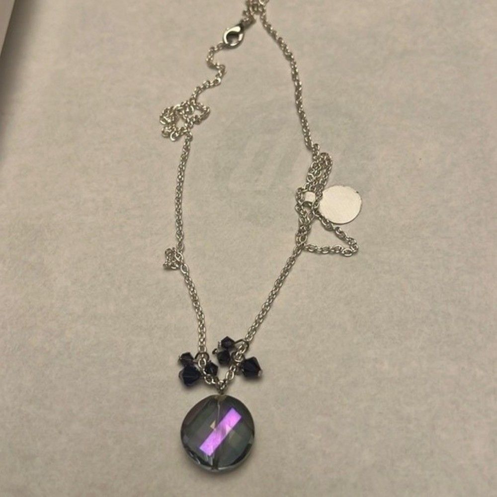 Handcrafted round pendant with beading on silver tone chain
